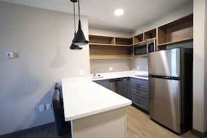 Fridge, microwave, stovetop, coffee/tea maker