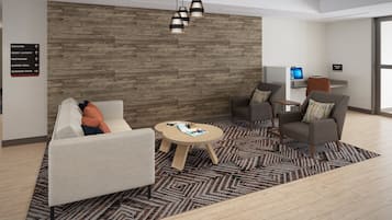 Un moderno hall de entrada con pared de madera, un mostrador de recepción y una zona de estar con alfombra estampada.