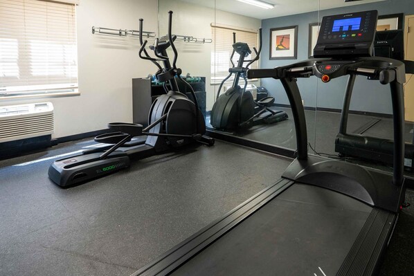 A gym with treadmills, elliptical machines, and a mirrored wall. - Extended Stay America Suites Norwalk Stamford (Norwalk)