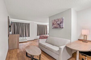 Suite, 1 King Bed, Non Smoking | Living area | 40-inch flat-screen TV with cable channels, TV