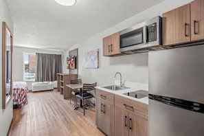 Suite, 1 King Bed, Non Smoking, Kitchenette | Desk, laptop workspace, blackout curtains, free WiFi