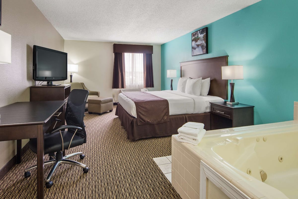 suite, 1 king bed, non smoking, jetted tub | pillow-top beds, desk, laptop workspace, blackout curtains