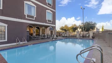 Outdoor pool, open 10:00 AM to 9:00 PM, pool loungers