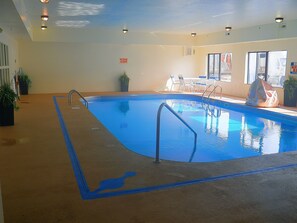 Indoor pool, open 10:00 AM to 10 PM, pool loungers