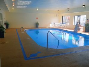 Indoor pool, open 10:00 AM to 10 PM, pool loungers