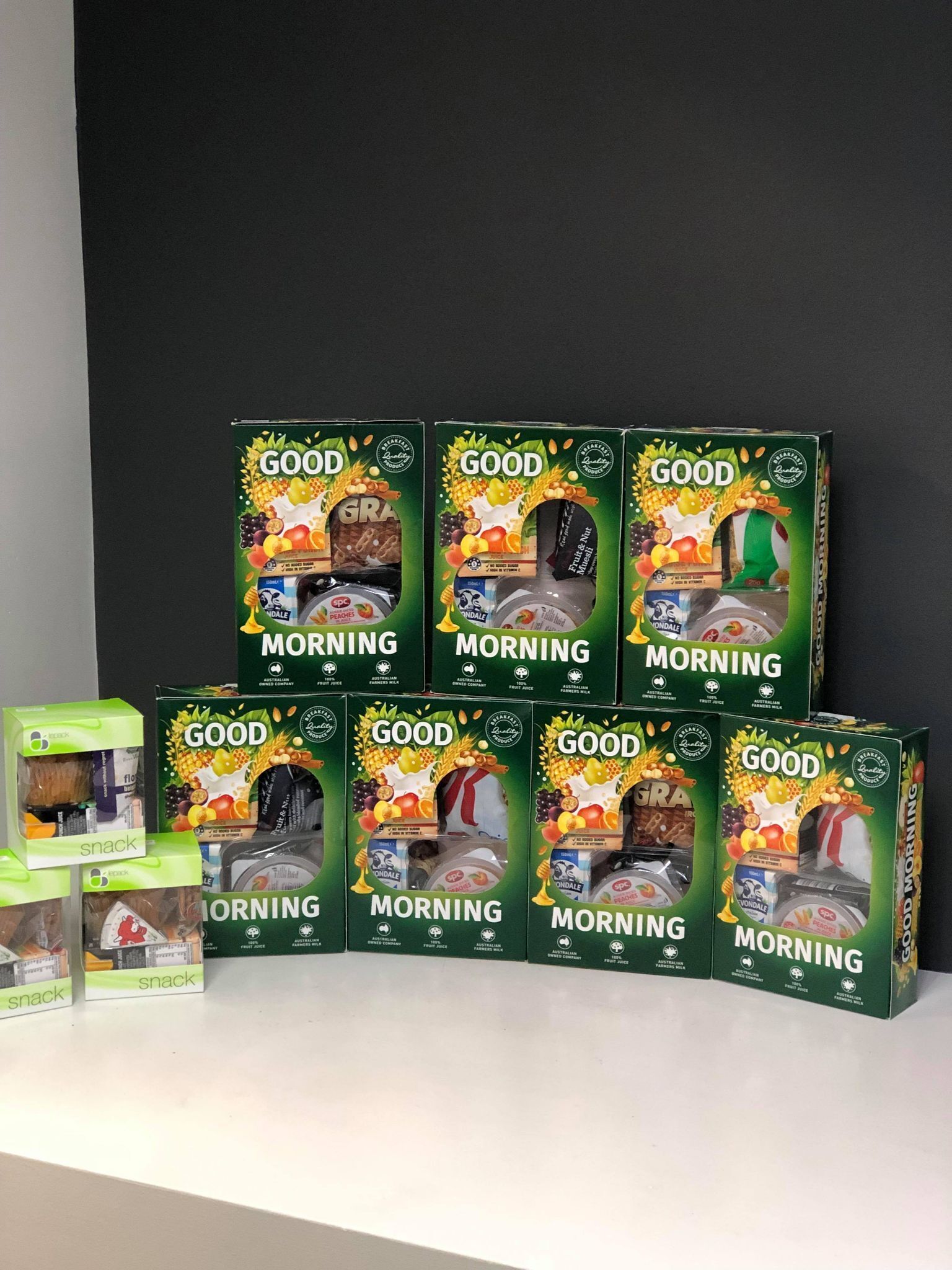 A display of Good Morning snack boxes arranged on a shelf.