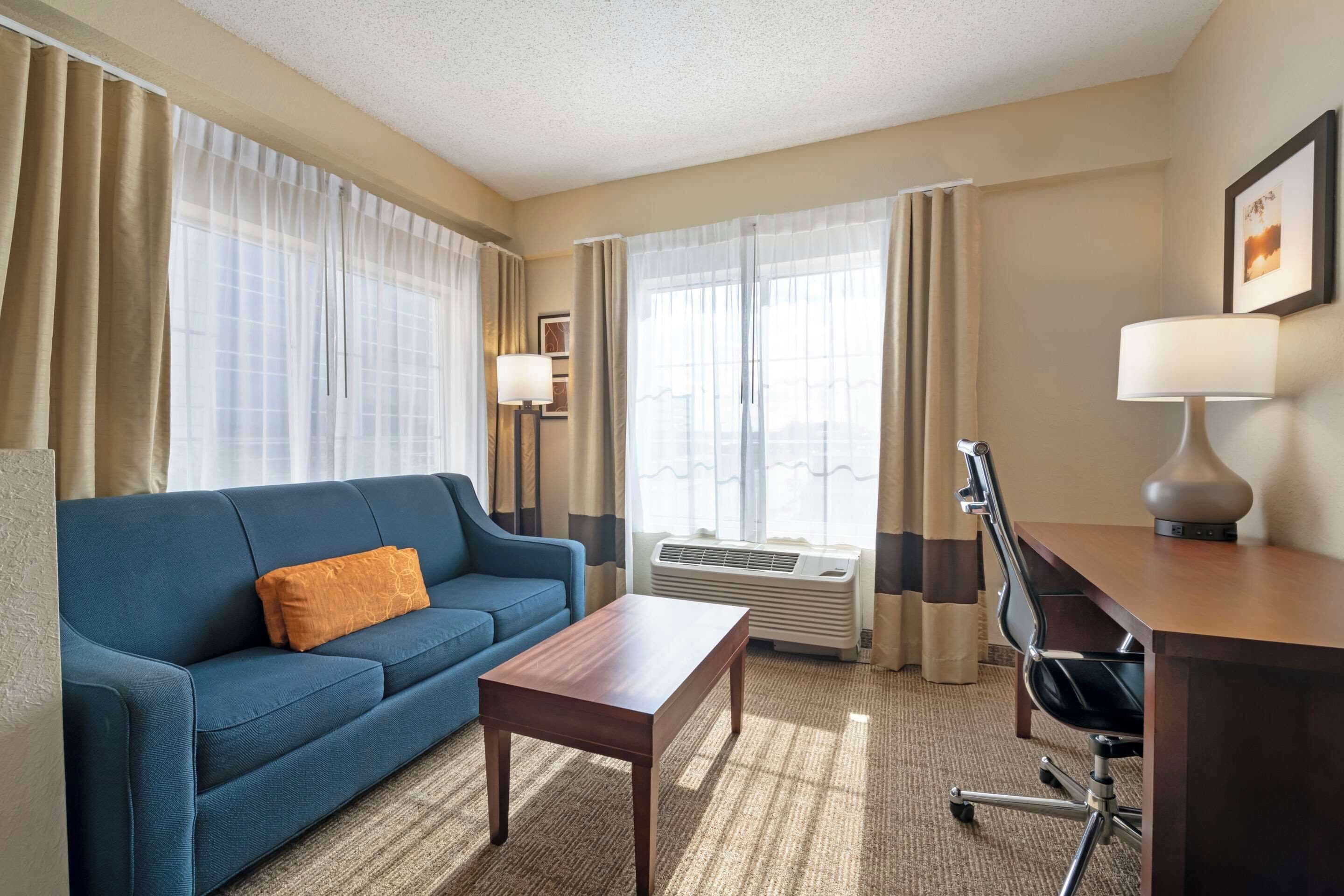 suite, 1 king bed, non smoking | desk, blackout curtains, iron/ironing board, free wifi