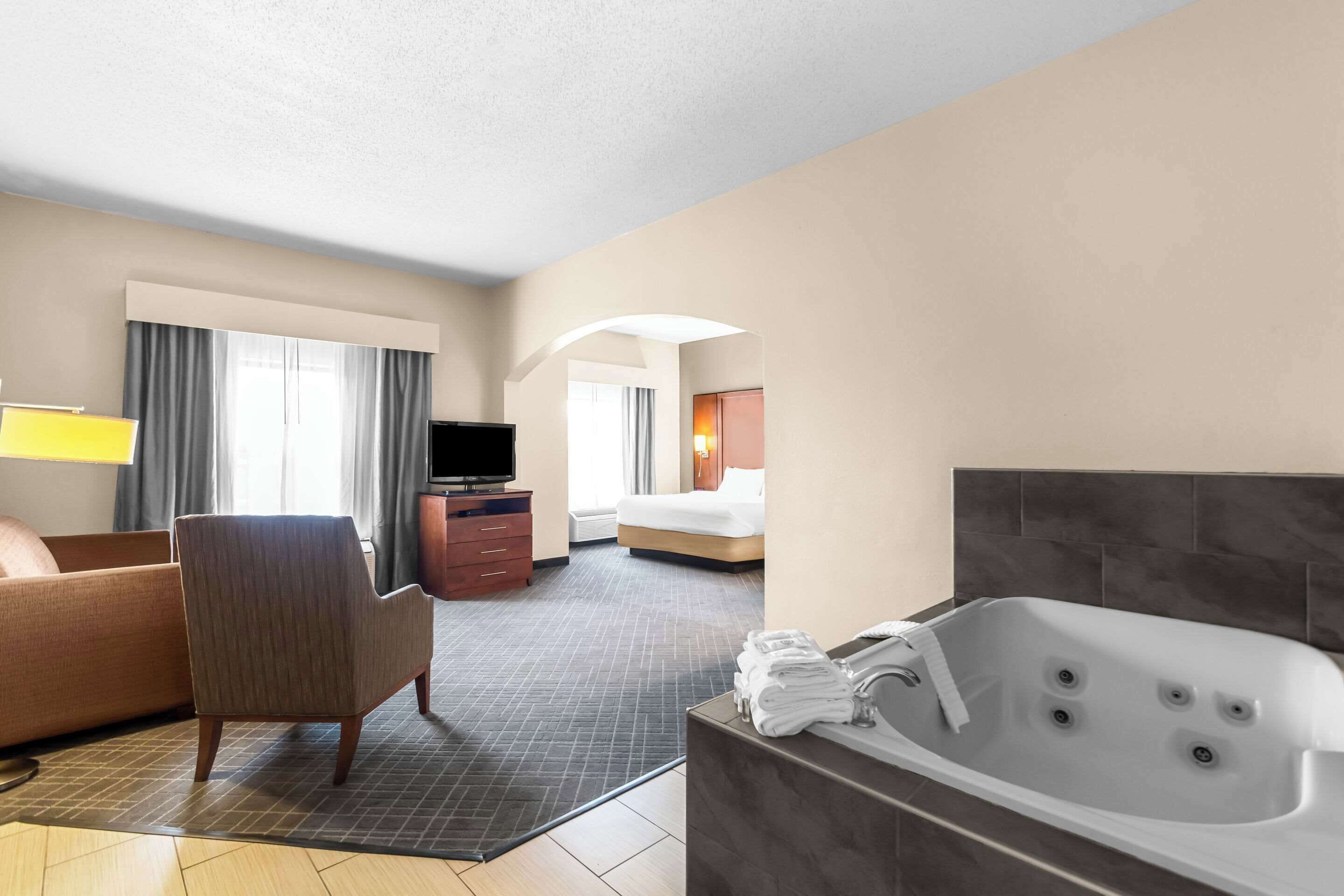 premium bedding, desk, blackout curtains, iron/ironing board