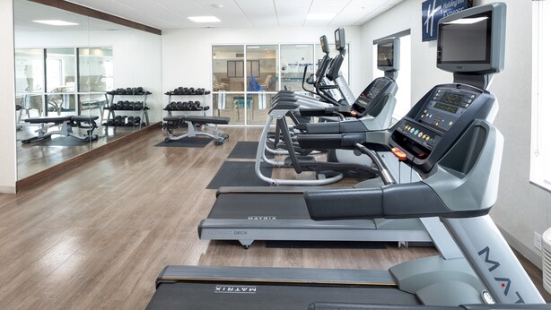A gym with treadmills, dumbbells, and exercise equipment. - Holiday Inn Express & Suites Chicago West - St Charles by IHG (St. Charles)
