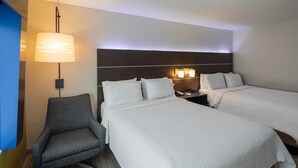 A hotel room with two beds, a desk, a chair, and a wall-mounted lamp. - Holiday Inn Express & Suites Chicago West - St Charles by IHG (St. Charles)