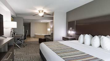Premium bedding, desk, laptop workspace, blackout drapes
