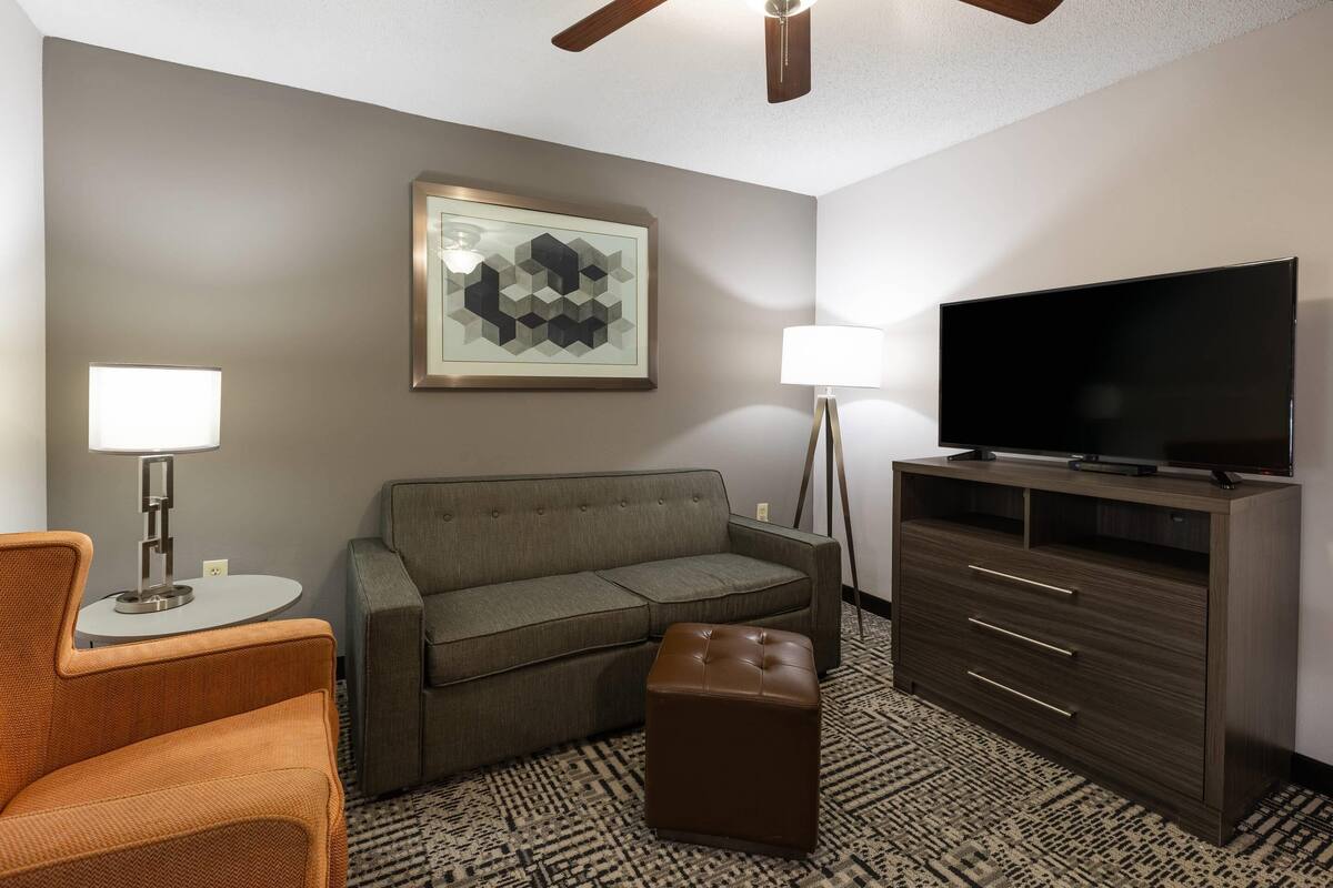 Premium bedding, desk, laptop workspace, blackout drapes