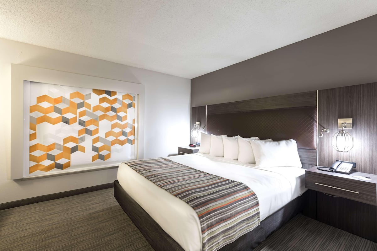 Premium bedding, desk, laptop workspace, blackout curtains