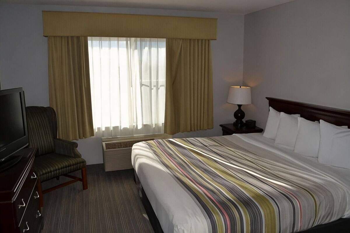 Down comforters, desk, blackout drapes, iron/ironing board