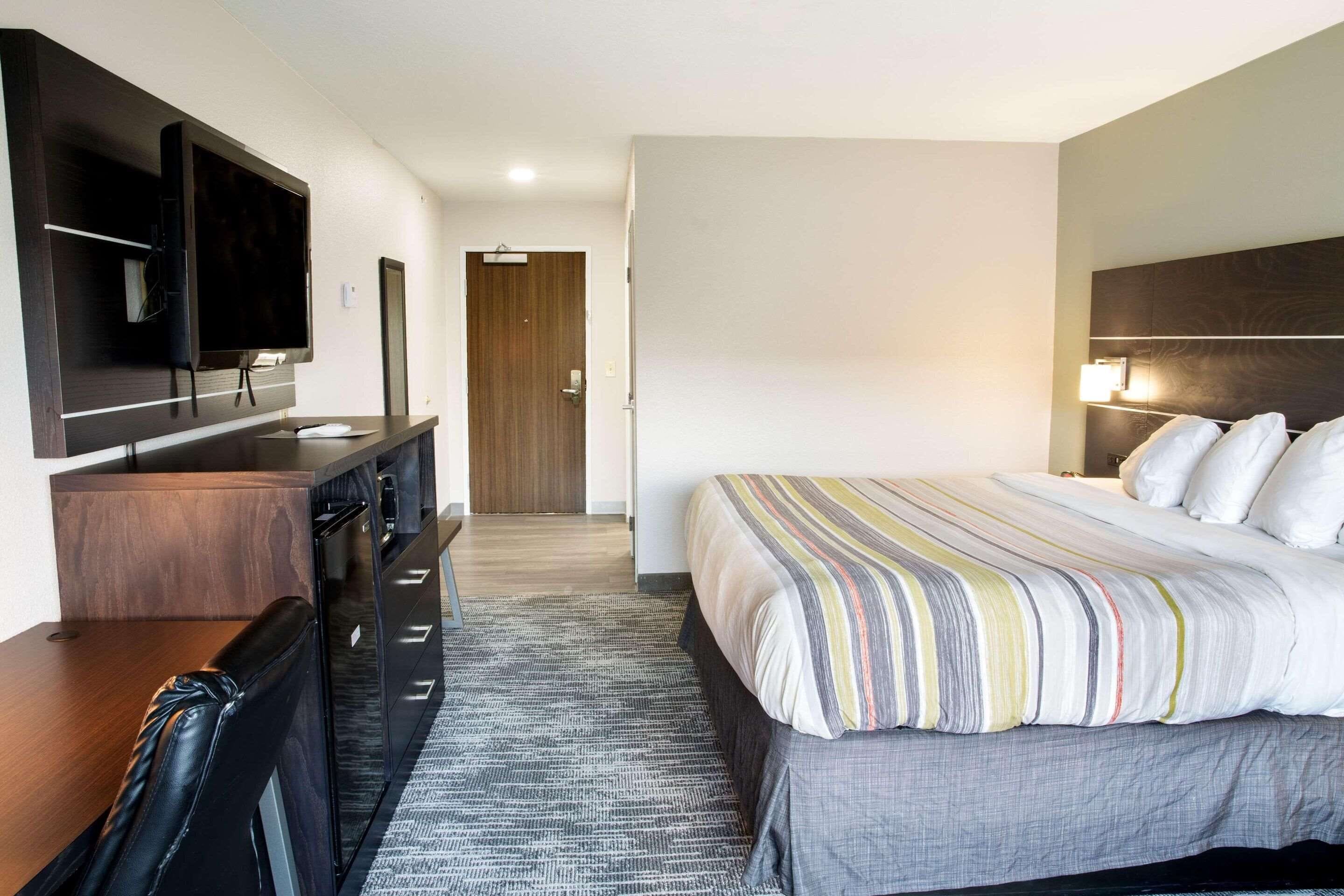 pillow-top beds, desk, laptop workspace, blackout curtains