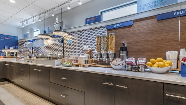 A breakfast bar with various food items and containers. - Holiday Inn Express Jonestown - Ft. Indiantown Gap by IHG (Jonestown)