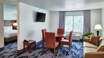 Premium bedding, desk, laptop workspace, blackout drapes