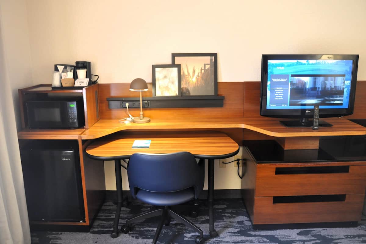 desk, laptop workspace, blackout curtains, iron/ironing board