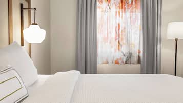 Premium bedding, desk, laptop workspace, iron/ironing board