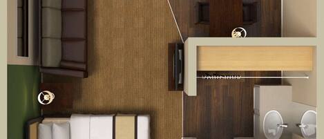 A compact hotel room with a bed, a small kitchenette, a bathroom, and a seating area.