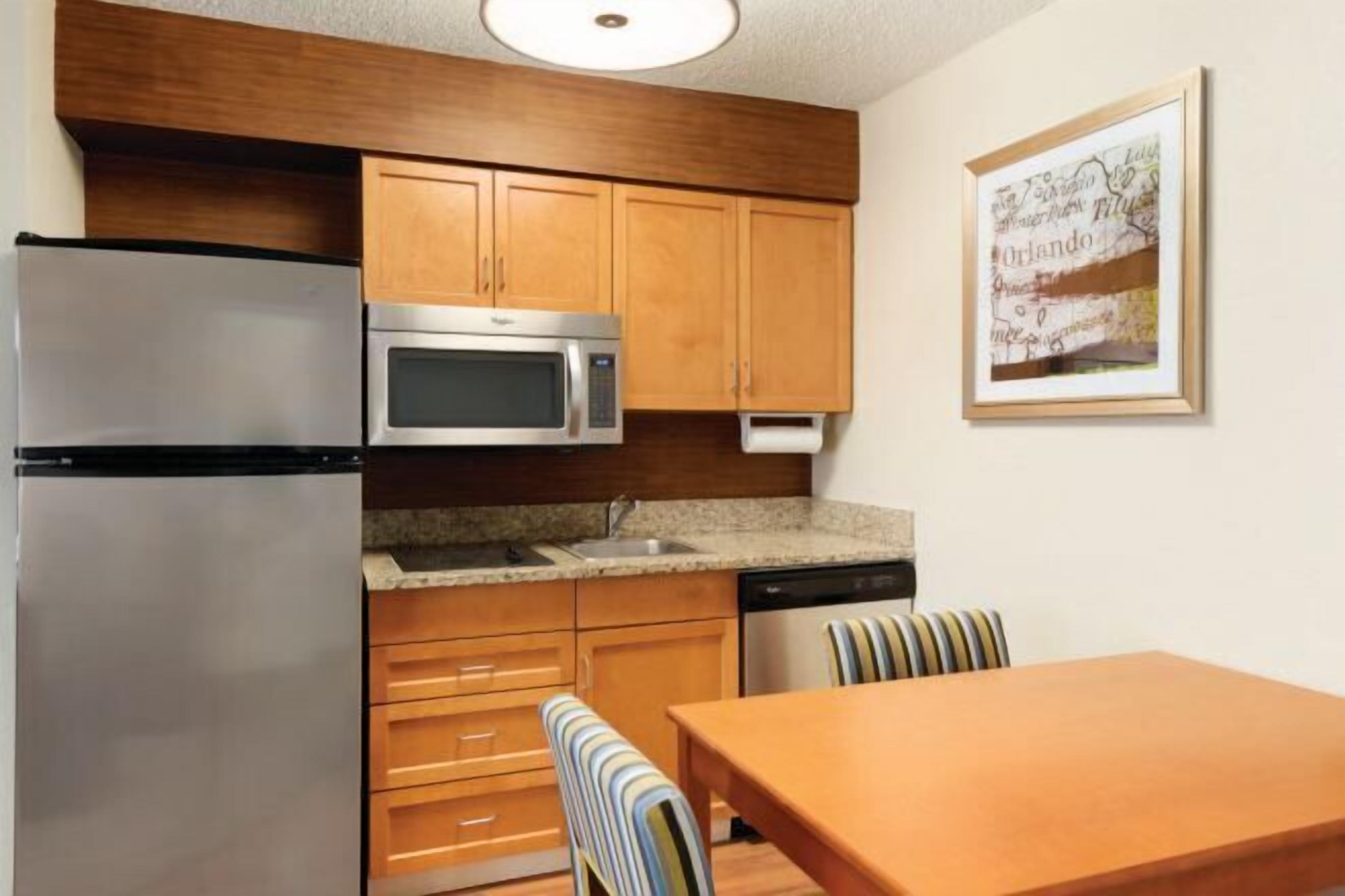 Full-size fridge, microwave, stovetop, dishwasher