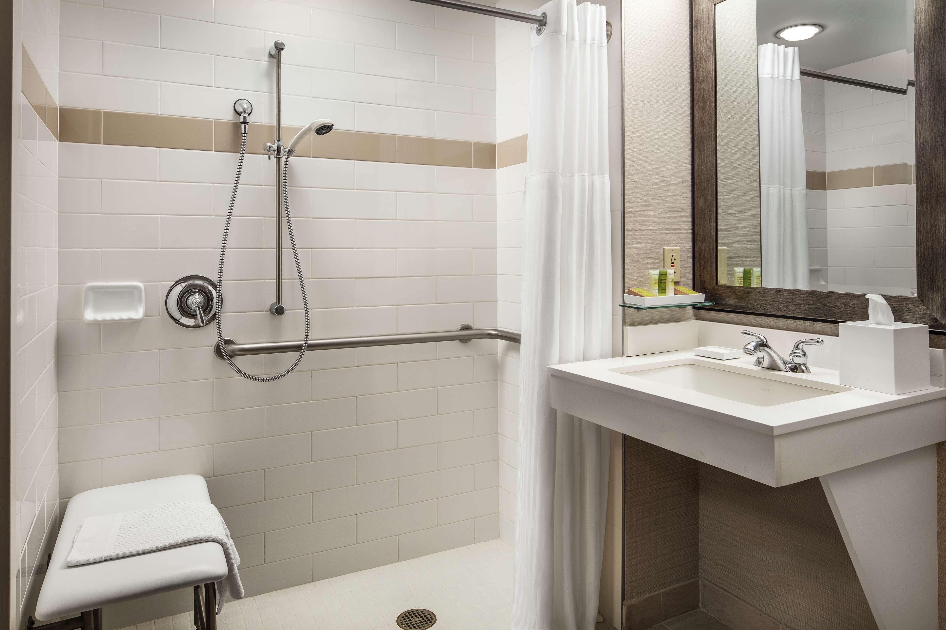 combined shower/bathtub, designer toiletries, hair dryer, towels