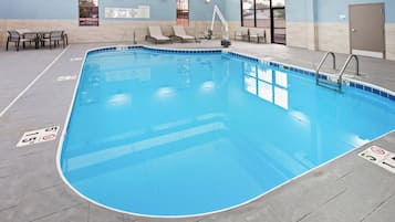 Indoor pool, open 7:00 AM to 11:00 PM, pool loungers