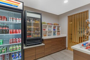 A vending area with various snacks and drinks, including soda cans and bottled water. - Best Western Plus Burlington Skagit Valley Inn (Burlington)