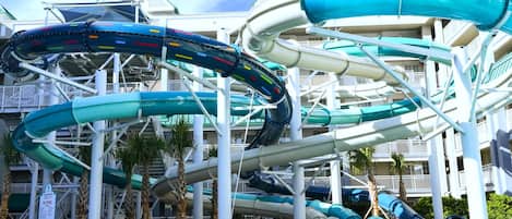 A water park with multiple slides and a pool area.