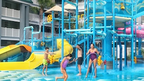 A water park with slides and water features. - Holiday Inn Resort Orlando Suites - Waterpark by IHG (Orlando)