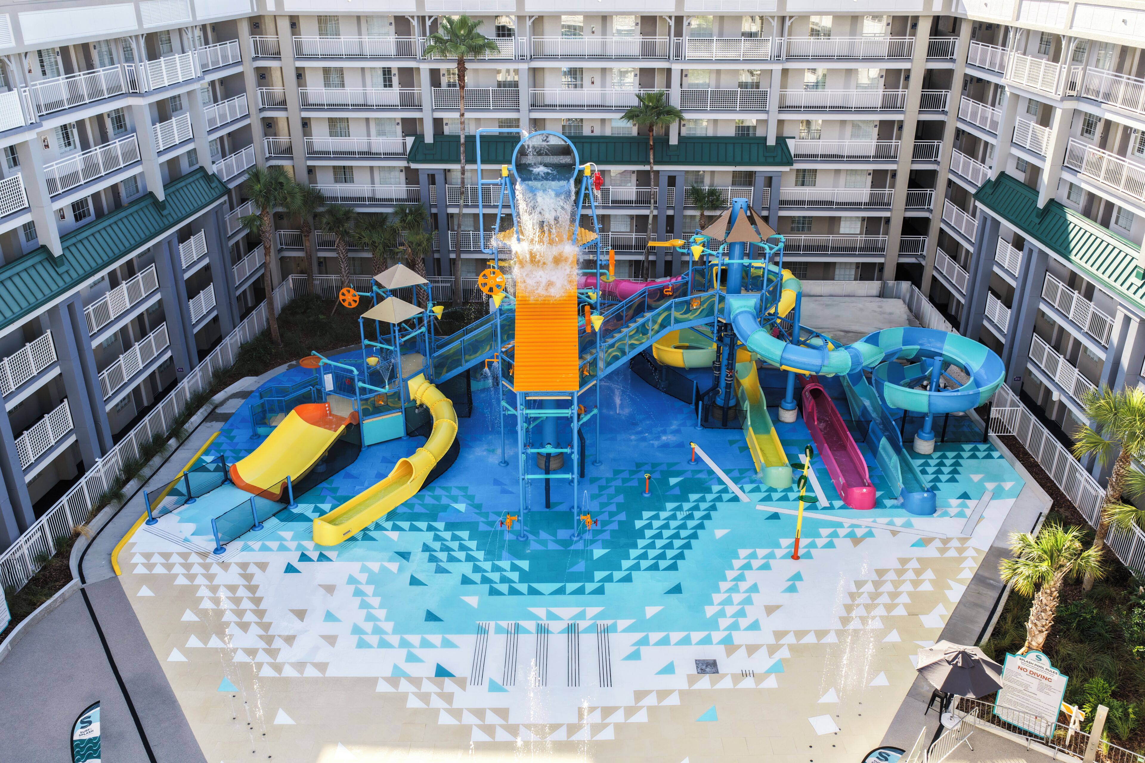 A water park with multiple slides and a central water feature.