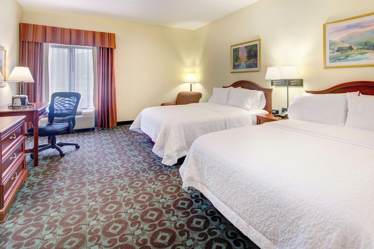Pillow-top beds, desk, blackout curtains, iron/ironing board