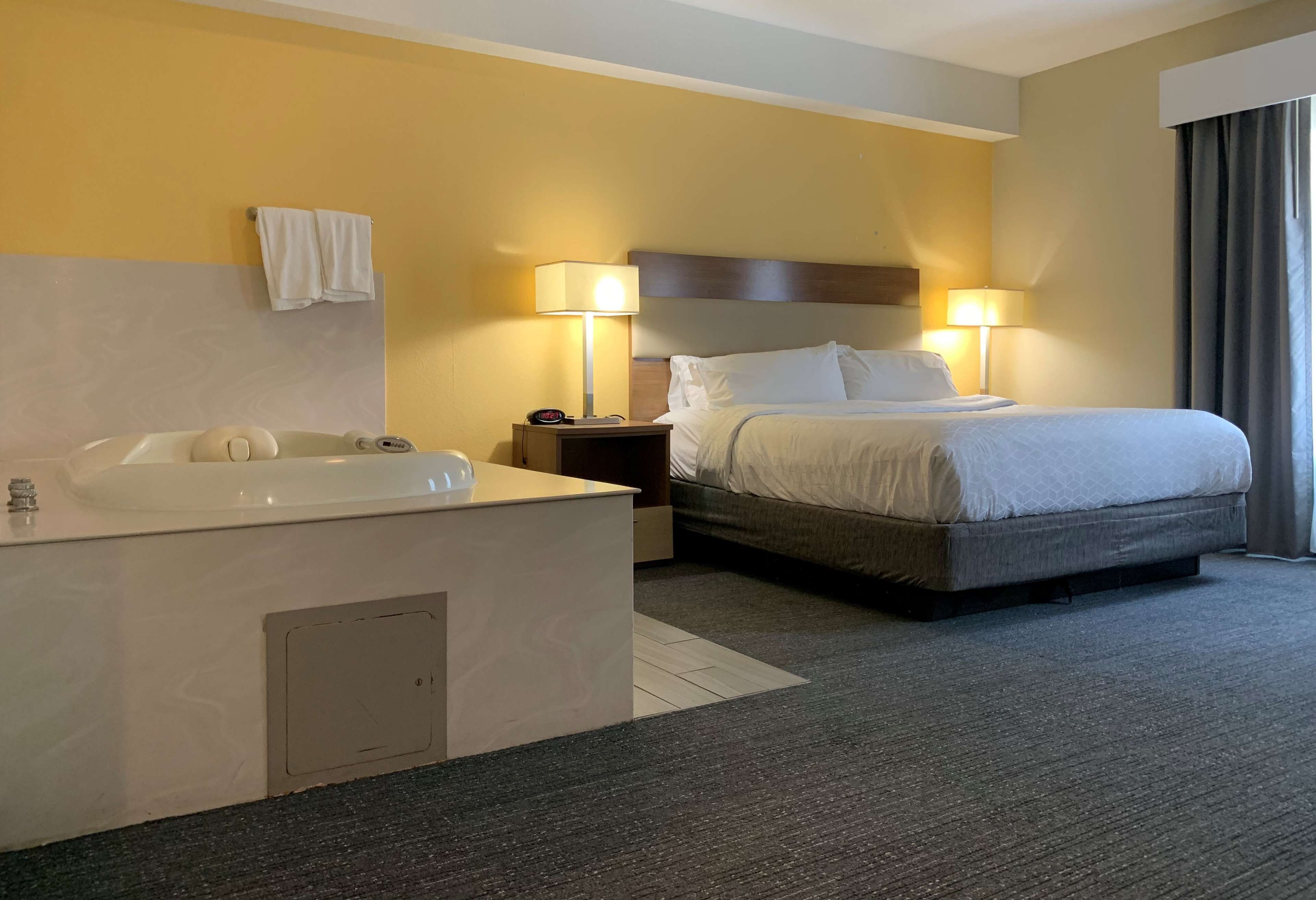 Suite, 1 King Bed, Non Smoking, Jetted Tub | Premium bedding, desk, blackout drapes, iron/ironing board