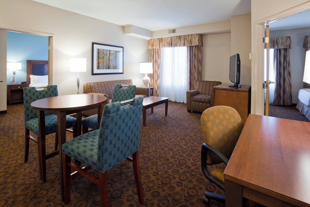 Desk, iron/ironing board, cribs (free), WiFi (free)