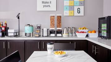 A modern kitchen with a coffee machine, a bowl of scrambled eggs, and a sign that says 'Make it yours.'