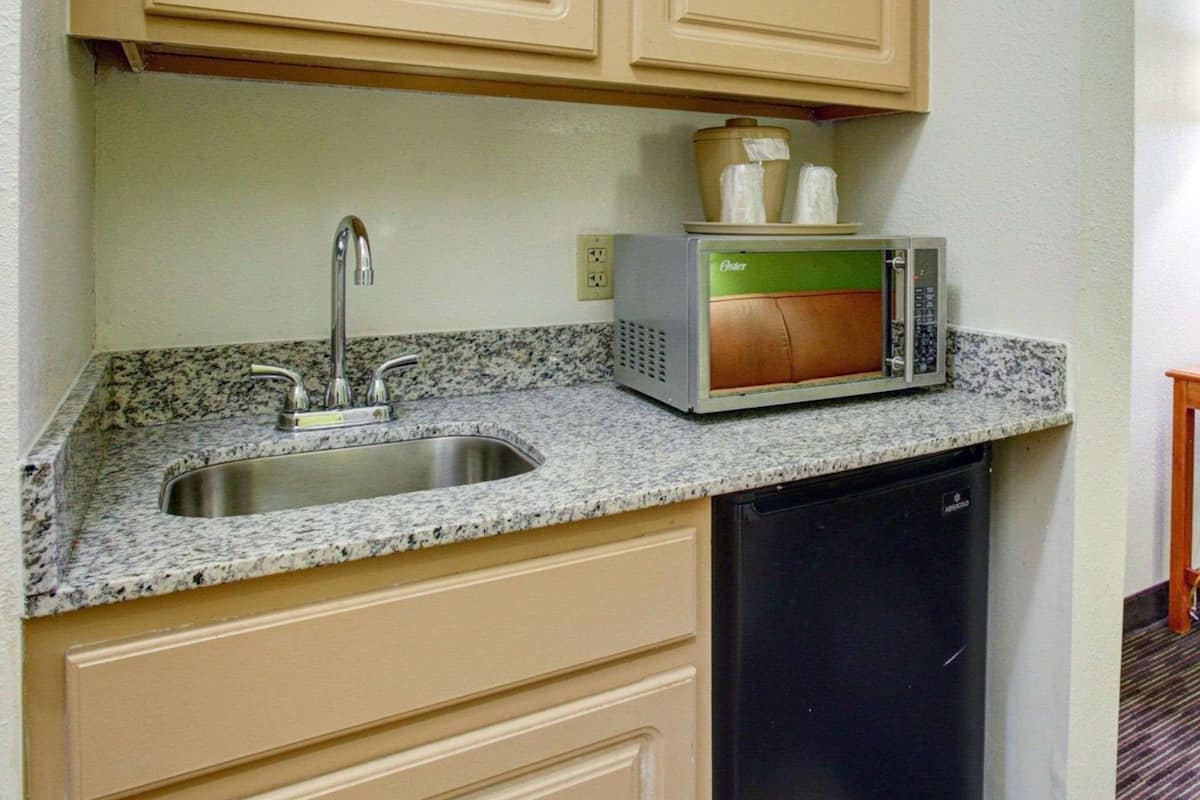 suite, 2 queen beds, non smoking | desk, blackout curtains, iron/ironing board, cots/infant beds