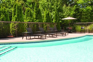 Seasonal outdoor pool, open 9 AM to 9 PM, pool umbrellas, pool loungers