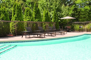 Seasonal outdoor pool, open 9 AM to 9 PM, pool umbrellas, pool loungers