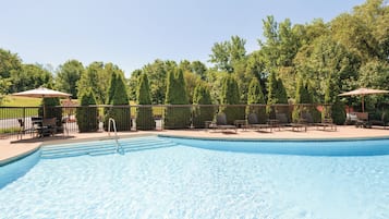 Seasonal outdoor pool, open 9 AM to 9 PM, pool umbrellas, pool loungers