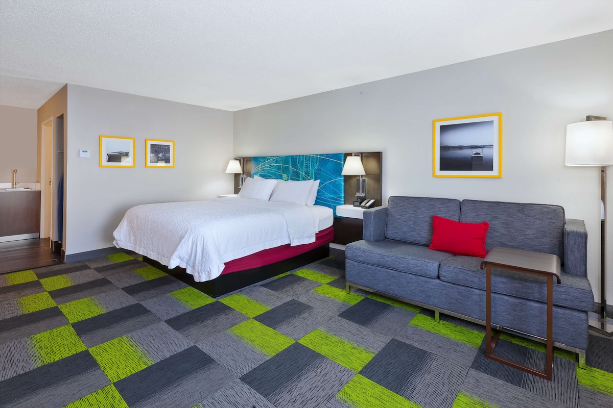 Spacious, One King Bed | Living area | 25-inch TV with digital channels