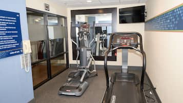A fitness center with treadmills, an elliptical, and a stationary bike.