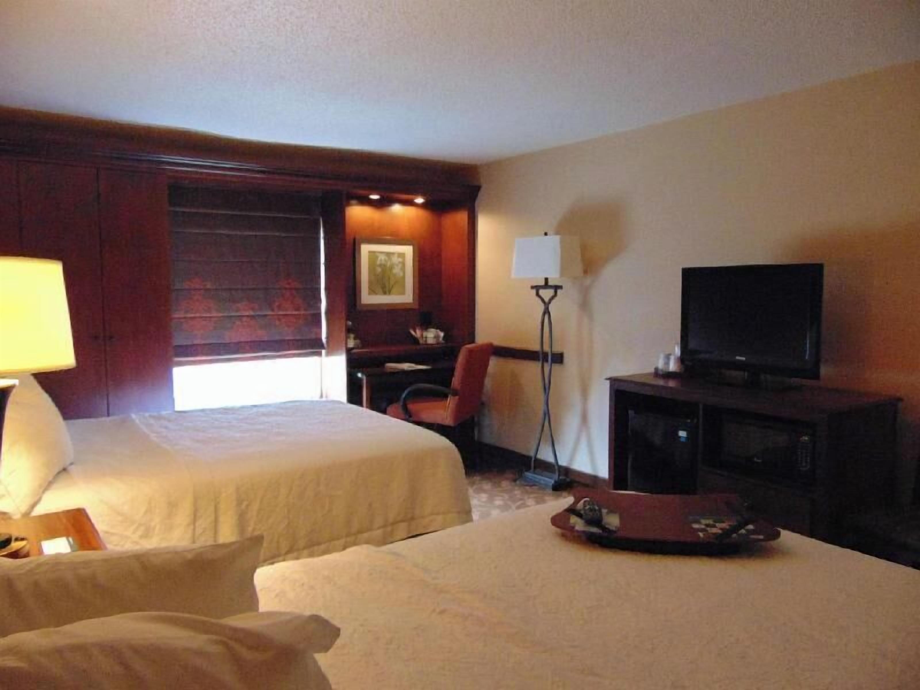 Desk, blackout drapes, iron/ironing board, bed sheets