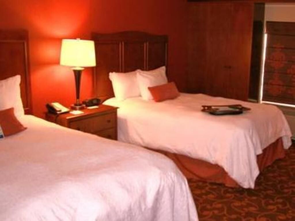 Desk, blackout drapes, iron/ironing board, bed sheets