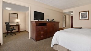 A hotel room with a bed, a desk with a chair, a television, and a wardrobe. - Hampton Inn by Hilton Lexington Park (Lexington Park)