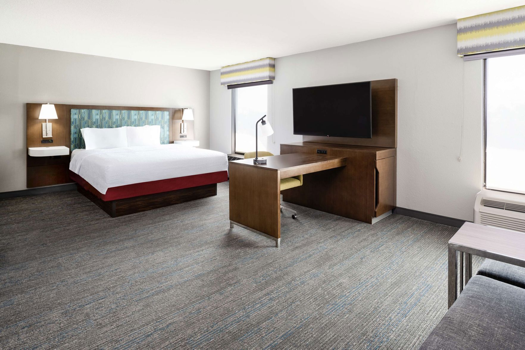 Premium bedding, desk, laptop workspace, blackout drapes