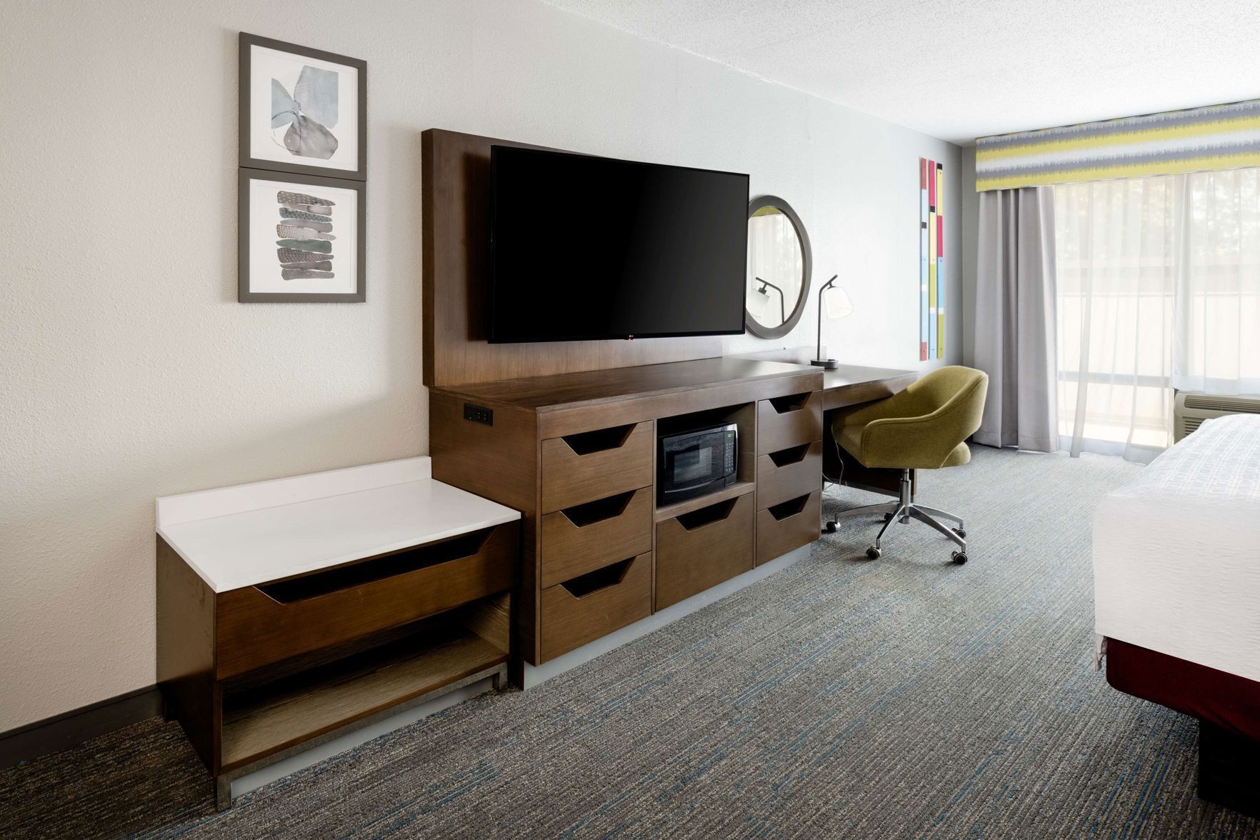 Premium bedding, desk, laptop workspace, blackout drapes