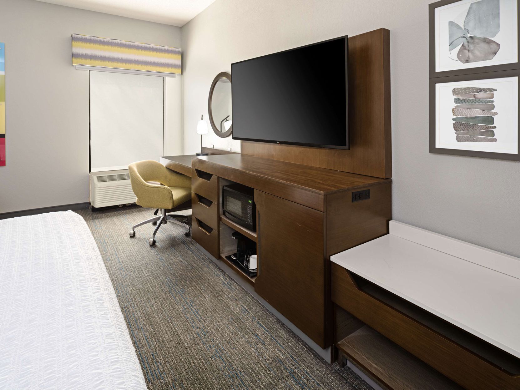 Premium bedding, desk, laptop workspace, blackout drapes