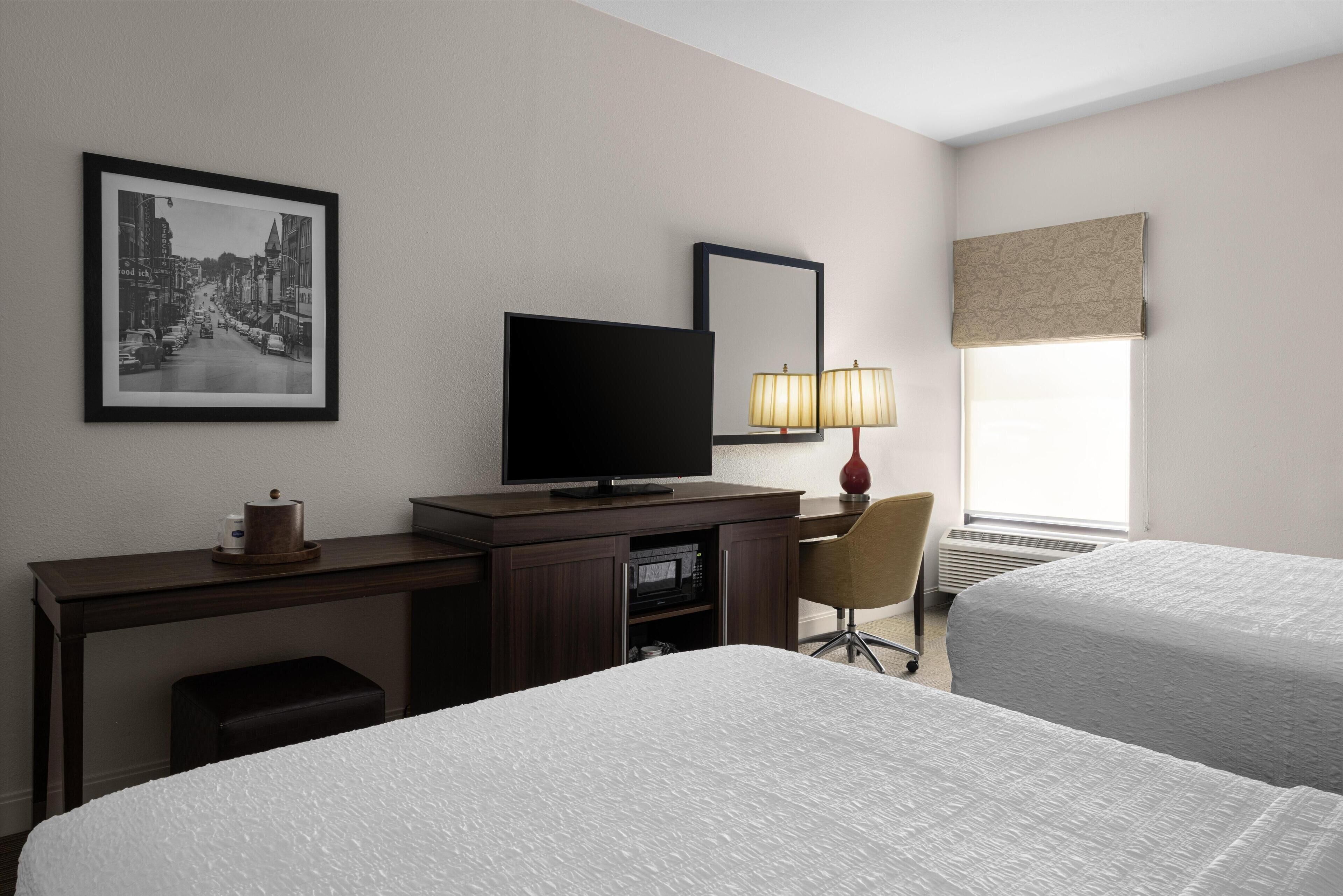 Hypo-allergenic bedding, desk, laptop workspace, blackout curtains