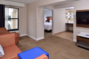 Suite, One King Bed, Non-Smoking | Living area | TV