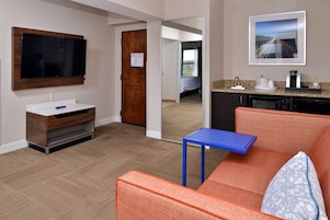 Suite, One King Bed, Non-Smoking | Living area | TV